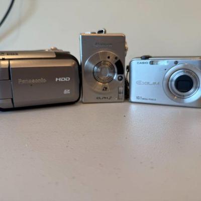 Digital Cameras  (Panasonic SDR H-40 Video Camcorder, Canon ELPH2, Casio Exilim) - Sold Separately.