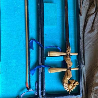Erhu believed to be Chinese in origin with beautiful Dragon head carving.  See next two photos.
