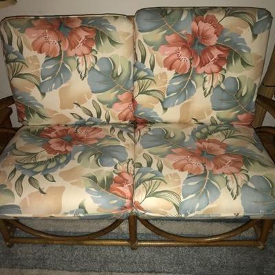 Mid-century rattan set nicely upholstered in reproduction vintage orint