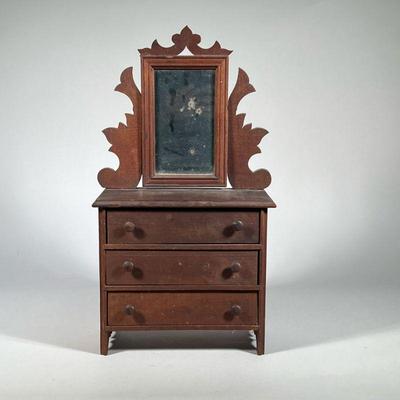 MINIATURE CHEST with MIRROR | Miniature three drawer chest, each full-width drawer with double pulls, with mirror on carved brackets. -...