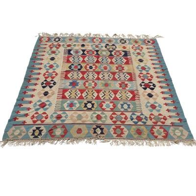 FLAT WOVEN KILIM RUG | Having colorful medallions on alternating tiles of color over a beige ground, pale blue border. - w. 97 x l. 117 in

