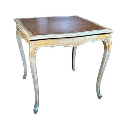 FRENCH LOUIS XV STYLE GAMES TABLE | Leather inset top with embossed gilt border and carved carbriole legs. - h. 27.5 x w. 30 x l. 30 in

