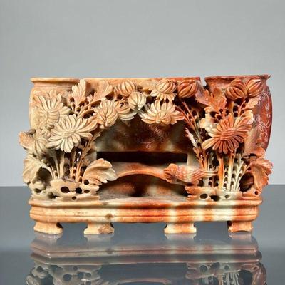 CHINESE SOAPSTONE TRIPLE VASE | Reticulated soapstone carving designed as two oval vases flanking a central rectangular vessel [lacking...