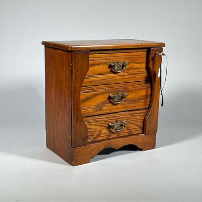 MINIATURE SIDE-LOCK CHEST | Chest with Walnut case and oak drawers. Brass handles and side locks with key. - h. 11.5 x w. 6.25 x l. 11 in

