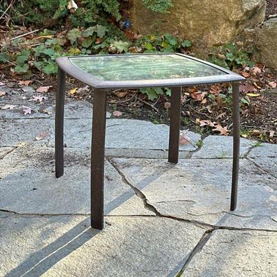 Brown Jordan Patio Side Table | Outdoor patio side table having a glass top on a metal base. - h. 16.5 x w. 20 x l. 20 in

