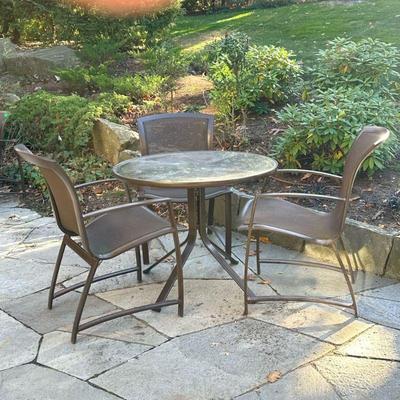 (4pc) Brown Jordan Table & Chairs | Outdoor dining suite comprising a round table and three armchairs (each h. 35.5 x 23.25 x 24 in.)...