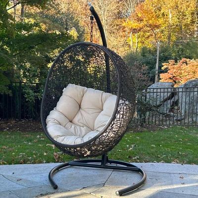 Outdoor Hanging “egg” Chair | Swing outdoor patio lounge chair having a woven frame with tufted seat cushion. - h. 69 x w. 39 x l. 39 in

