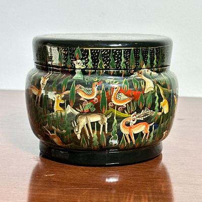 INDIAN LACQUERED BOX | Indian lacquered and gilt lidded box decorated with animals. - h. 4 x dia. 5 in


