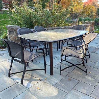 (7pc) BROWN JORDAN PATIO DINING SET | Outdoor furniture dining suite, including six armchairs (h. 34 x 25 x 29 in.) and a glass top table...