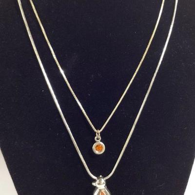 Sterling Silver Necklaces with Topaz Colored Gems (2): Penguin & Solitaire