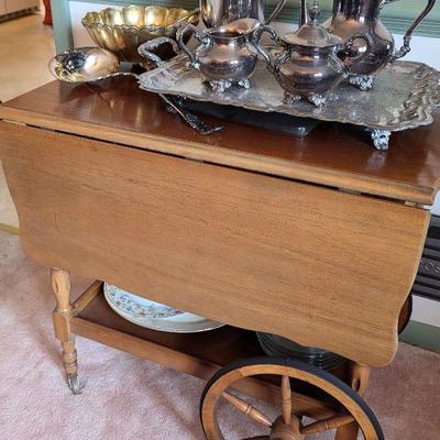 Tea cart with drop leaf sides.