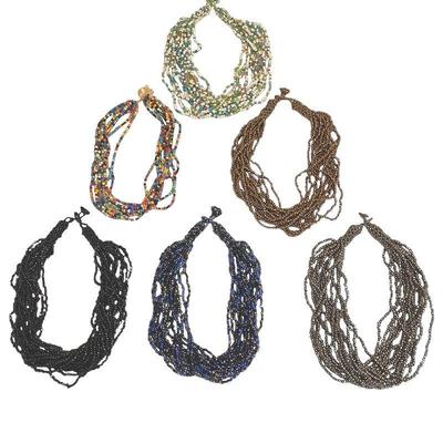 ROHU575 Collection Of African Bead Chokers	six multi strand natural stone and glass beaded chokers from Africa. One black one midnight...