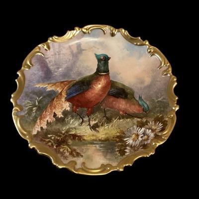 ROHU531 Large Signed Pheasant Platter	Gilt edged painting of pheasant signed by Mary Louise Seattle, who died in 1950 at the age of 94.
