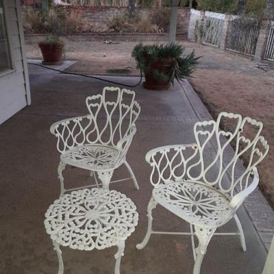 Oversized potted plants and patio furniture