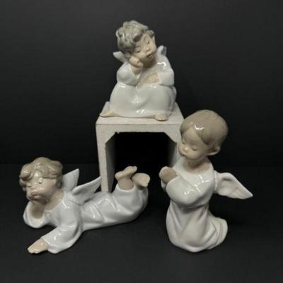 A Trio of Heavenly Grace: Lladró Porcelain Angel Figurines	