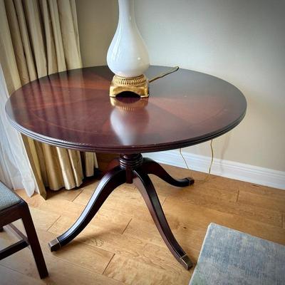 Round table with brass feet