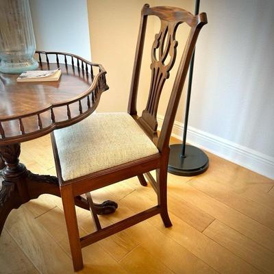 One of five vintage Chippendale-style chairs. Seats removable for recovering.