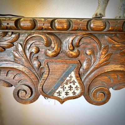 Antique European console table with barley twist legs. Fleur de Lis on the shield carved into the front. 