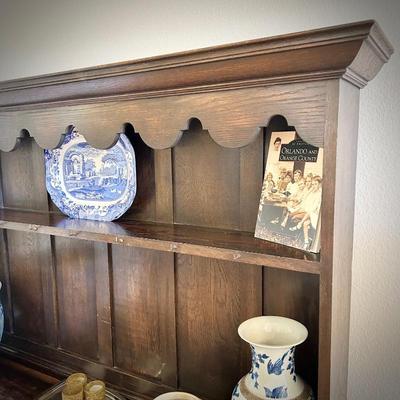 Antique sideboard with hutch. Three drawers and two cupboards. The top shelf has hooks.