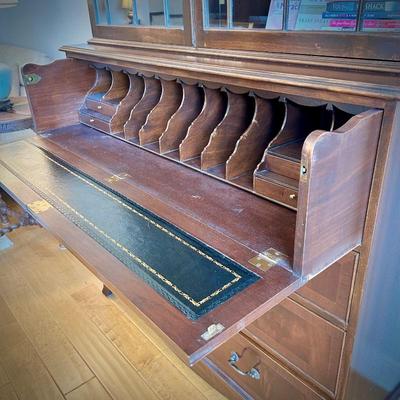 Antique mahogany secretary. Desk portion with leather inlay rolls out. Two pieces for easy transportation.