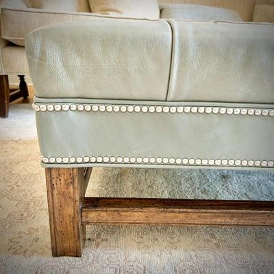 Pale Tiffany blue leather ottoman with nailhead trim