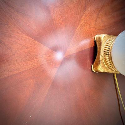Round table with brass feet