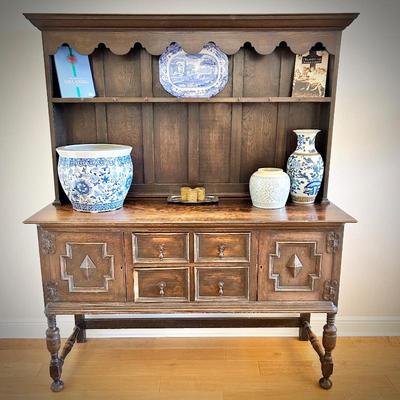 Antique sideboard with hutch. Three drawers and two cupboards. The top shelf has hooks.