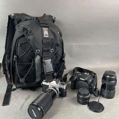 Lot 455 | Nikon & Canon Cameras In Ape Case Camera Backpack
