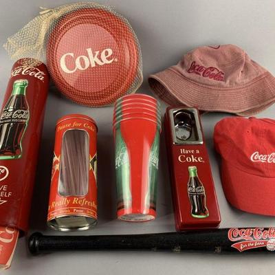 Lot 418 | Coca Cola Hats, Cup Holder, Bat & More!
