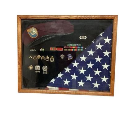 TEWA716 Military Shadow Box	Lot includes a variety of military ribbons and badges.  The Bo's measures approximately 20.5" wide...