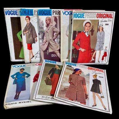 LUGR700 Vintage Vogue Paris Original, Patterns	Collection of 8 different sewing patterns. Some patterns are cut, others are uncut. 
