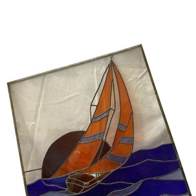 LUGR706 Stained Glass Of Sailboat	Glass has odd dimensions - 28" base, 30" by Sail side, 26" at the top and 21" on...