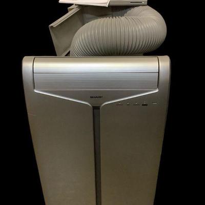 TEWA618 Sharp Portable Air Conditioner	This lot includes unit, tubing with window attachment, replacement sizes for window attachment,...