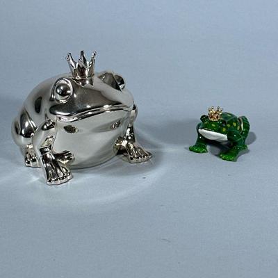 (2pc) DECORATIVE FROGS | Chromed prince frog coin bank and ceramic prince frog. - h. 4 x w. 3.5 x l. 5 in

