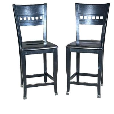 (2pc) PAIR BERMEX WOOD STOOLS | Made in Canada, a pair of black painted carved wood stools with curved back, seat height 24 in. - h. 40.5...