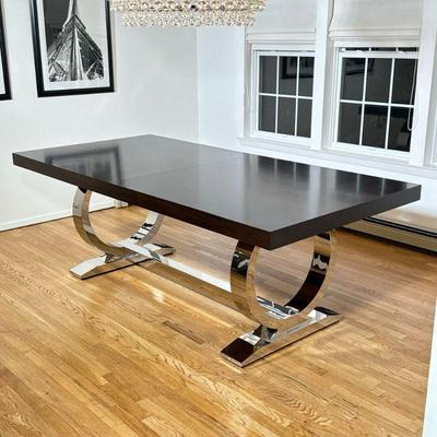 Z GALLERIE CHROME & WOOD DINING TABLE | A contemporary dining table from Z Gallerie featuring a rectangular wood veneer top in a dark...