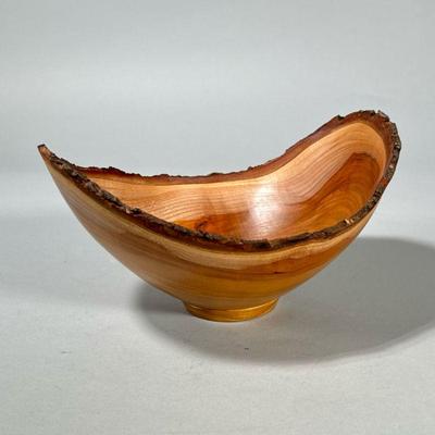 KAS KIRSEBAR TURNED WOOD BOWL | Signed on the bottom, of nicely figured wood with a natural rim. - h. 5 x w. 7 x l. 9 in

