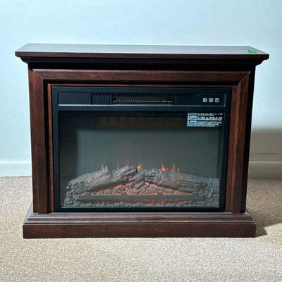 ELECTRIC FIREPLACE | A faux fireplace electric heater with remote control. - h. 25 x w. 31 x d. 11 in

