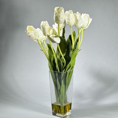 FAUX FLORAL ARRANGEMENT | Having fabric flowers in acrylic "water" in a square glass vase. - h. 26 x w. 5 x l. 5 in

