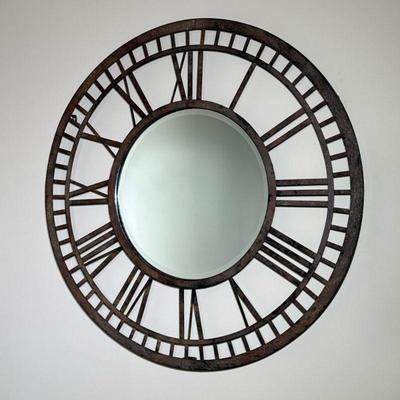 RUSTIC IRON CLOCK-FORM WALL MIRROR | Round wall mirror in the form of a clock face with Roman numerals, having a beveled glass mirror...