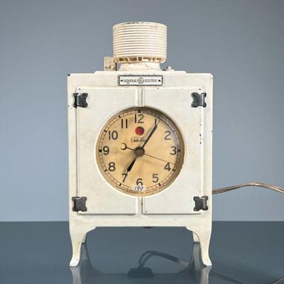 GENERAL ELECTRIC CLOCK | GE heavy cast metal refrigerator-form clock, electric. - h. 8.5 x l. 5 x d. 3.25 in

