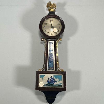 MINIATURE NEW HAVEN CLOCK | Miniature New Haven Clock Co. banjo clock decorated with ship scene to lower panel, face marked, with Arabic...