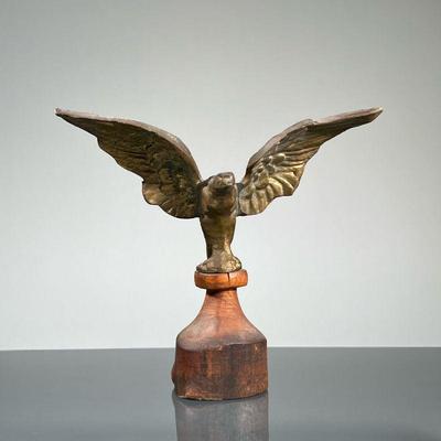 BRASS EAGLE FINIAL | Brass eagle figurine mounted on wood. - h. 7 x w. 4 x l. 7.5 in

