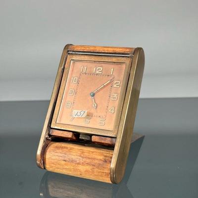 LE COULTRE TRAVEL CLOCK | Jaeger Le Coultre brass and wood folding travel clock, the copper face with Arabic numerals and signed 