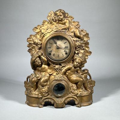 ITALIANATE METAL CLOCK WITH PUTTI | Noah Pomeroy, Bristol, CT circa 1847-78, gold-painted cast iron front with a wood back, the face with...