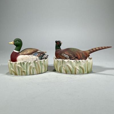 (2pc) PAIR LEFTON BISQUE BOXES | Bird-form lidded boxes, including a duck and a pheasant, each marked on the bottom. - l. 8 in (largest)

