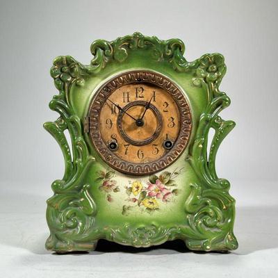 MASONIA PORCELAIN SHELF CLOCK | Green glazed porcelain shelf clock with flower decoration from Masonia Clock Co. New York. - h. 10.5 x w....