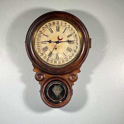 STANDARD INGRAHAM CALENDAR REGULATOR | Calendar wall clock by Charles F. Adams Company, Erie, in a grain painted and carved wood case,...