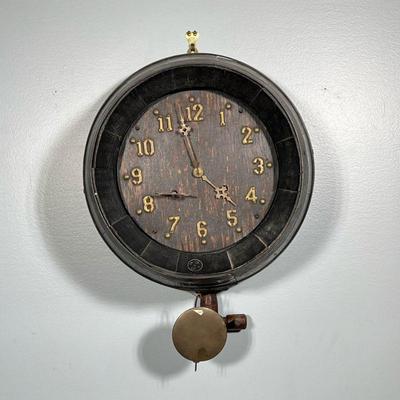 WINE BARREL FORM CLOCK | With applied brass Arabic numeral markers, old black paint, with old tap at the bottom behind pendulum. - d. 10...