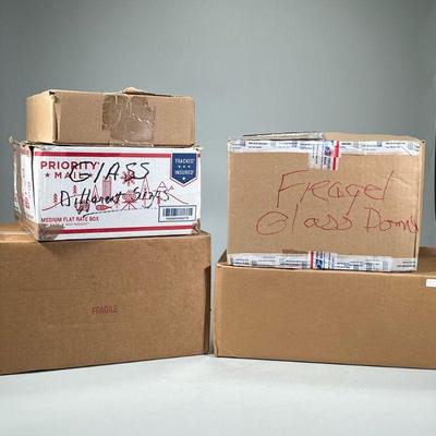 (5pc) MISC. CLOCK PARTS | Five large boxes of miscellaneous clock parts, including boxes labeled, "Crystal Reg Clock Case No...